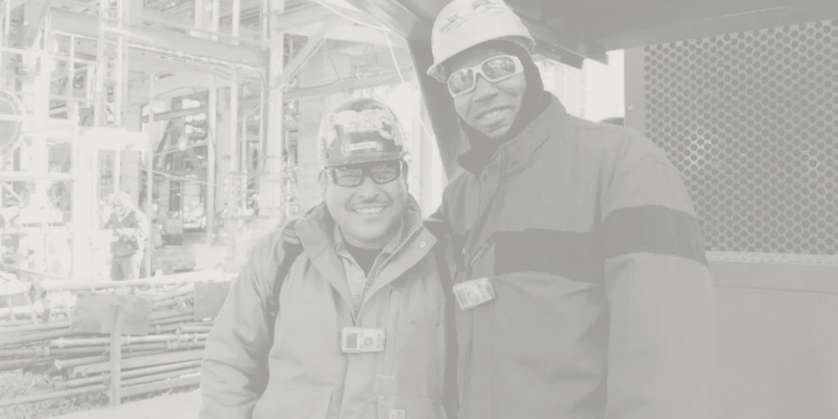 Two PFS Employees with Hard Hats on Job site